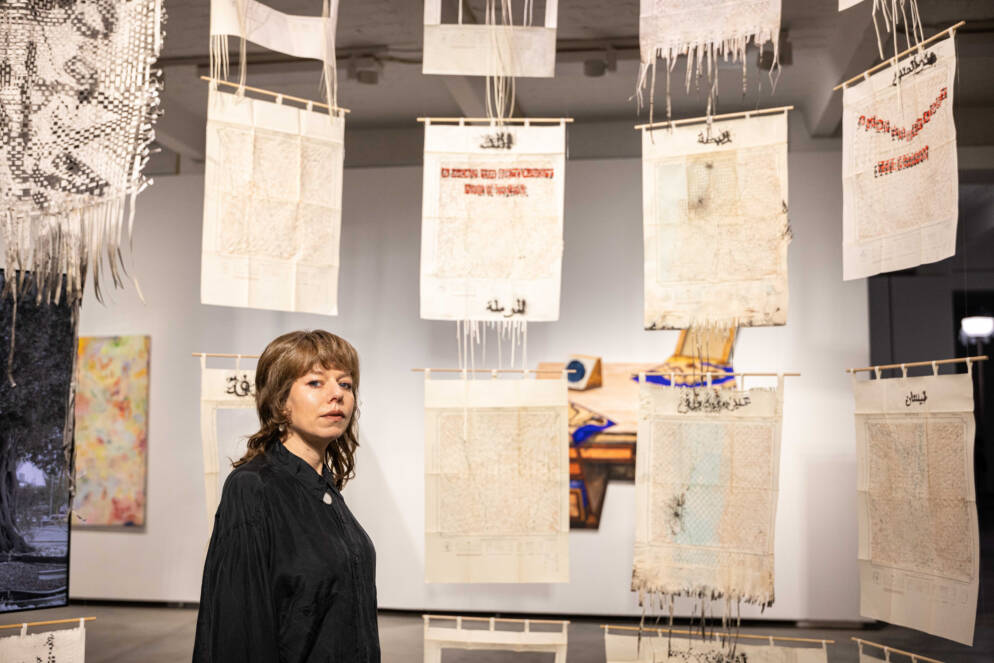 A woman is surrounded by art