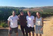 Four people standing outdoors