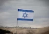 Sa’ar: No Sovereignty Over Judea and Samaria, ‘At Least in Coming Months’ A blue and white Israeli flag.