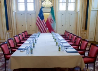 Trump Signs Iran Deal in Versailles A meeting table in the Blue Salon of the Palais Coburg Hotel in Vienna, Austria, awaits U.S. Secretary of State John Kerry and Iranian Foreign Minister Javad Zarif before their meeting on Jan. 16, 2016, about the implementation of the Joint Comprehensive Plan of Action outlining the shape of Iran’s nuclear program.