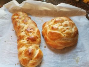 braided challah and a round challah
