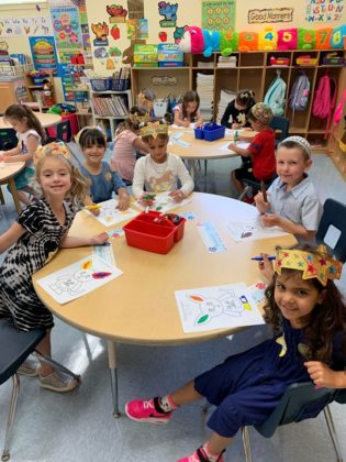 Kindergarten students sitting at a table