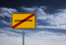 sign with the word antisemitism crossed out