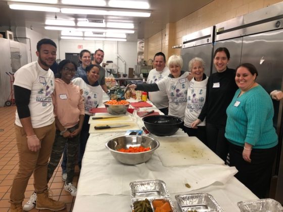 Volunteers participate in the Cook for a Friend program.