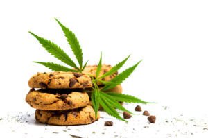 Chocolate chip cookies with marijuana isolated on white background