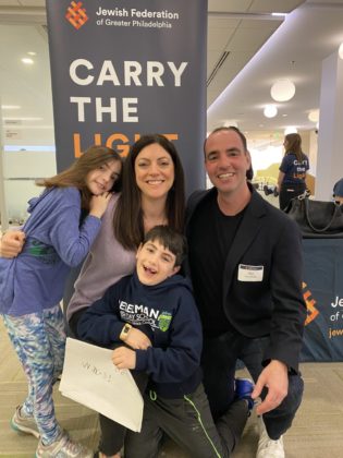 Super Sunday chairs Allison and Stu Goodman pose for a photo with their children at JFCS Brodsky Center in Bala Cynwyd.