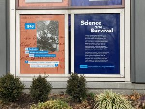 Large rectangular windows are covered in decals with pictures and descriptions.