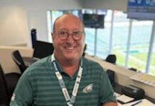 Jeff Asch: Building a Legacy Over the Airwaves Jeff Asch holds the game ball given to him by the Philadelphia Eagles.