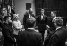 A group of men and women standing in a circle.