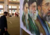 An older man walks past an image of the former and current Iranian supreme leaders (from left) Ayatollah Ruhollah Khomeini, Ali Khamenei, and his son, current leader Mojtaba Khamenei, at Imam Khomeini Mosque (Mosalla) in Tehran on May 24, 2026.